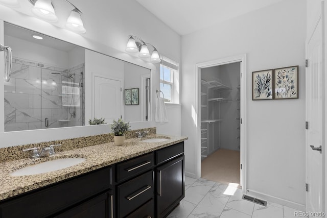 17960 Weymouth Ave, Parker, CO 80134 - bathroom with a marble finish shower, marble finish floors, double vanity, and a spacious closet