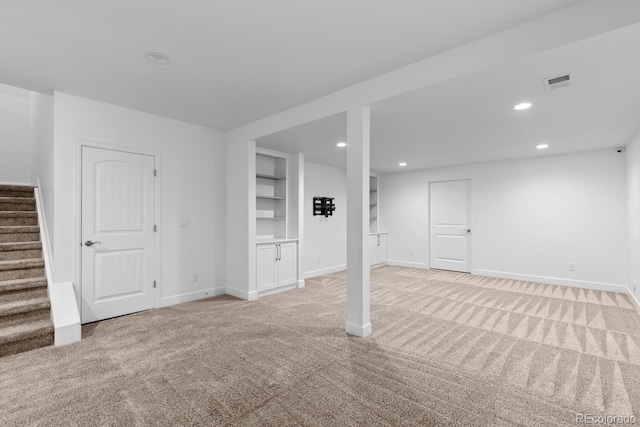 17960 Weymouth Ave, Parker, CO 80134 - finished below grade area with light colored carpet, stairway, recessed lighting, and built in shelves