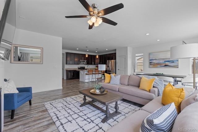 17960 Weymouth Ave, Parker, CO 80134 - living room featuring light wood-style flooring, recessed lighting, and a ceiling fan