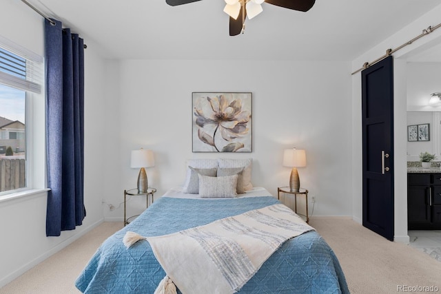 17960 Weymouth Ave, Parker, CO 80134 - bedroom featuring light colored carpet, a barn door, and ceiling fan
