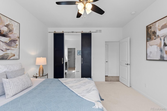 17960 Weymouth Ave, Parker, CO 80134 - bedroom featuring carpet flooring, ceiling fan, and a barn door