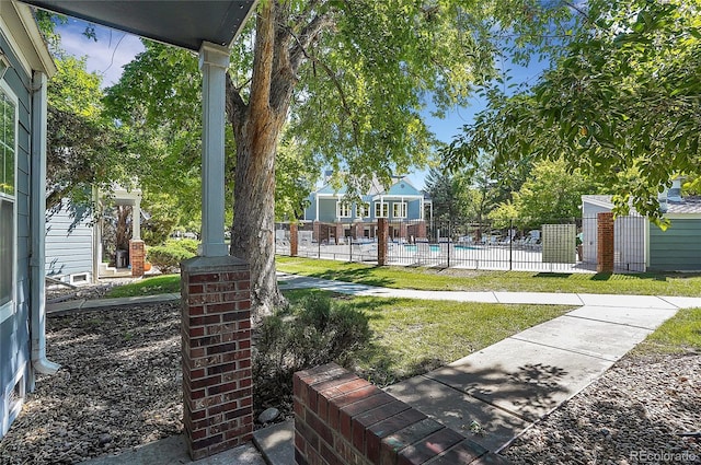 view of yard featuring a community pool