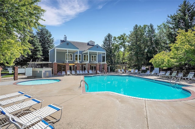 view of swimming pool with a patio area