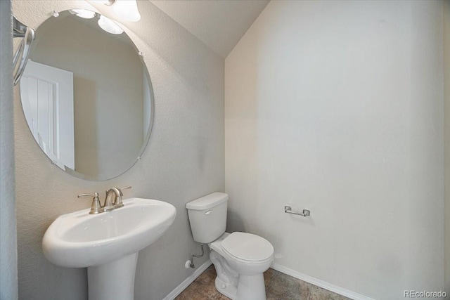 bathroom featuring tile patterned flooring, sink, and toilet