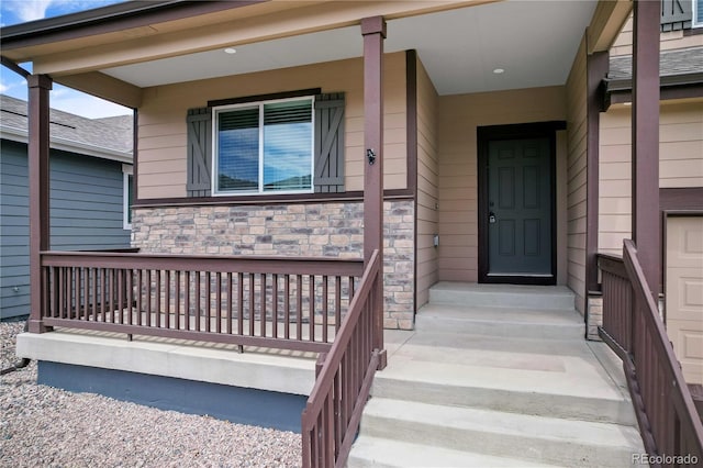 827 Forest Canyon Rd, Severance, CO 80550 - doorway to property with stone siding and covered porch