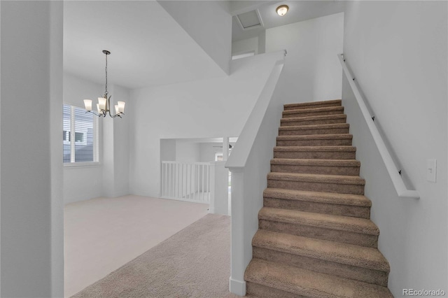 827 Forest Canyon Rd, Severance, CO 80550 - staircase featuring carpet flooring and a chandelier