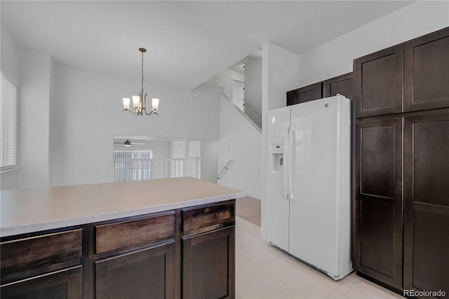 827 Forest Canyon Rd, Severance, CO 80550 - kitchen featuring white fridge with ice dispenser, a chandelier, dark brown cabinets, and hanging light fixtures