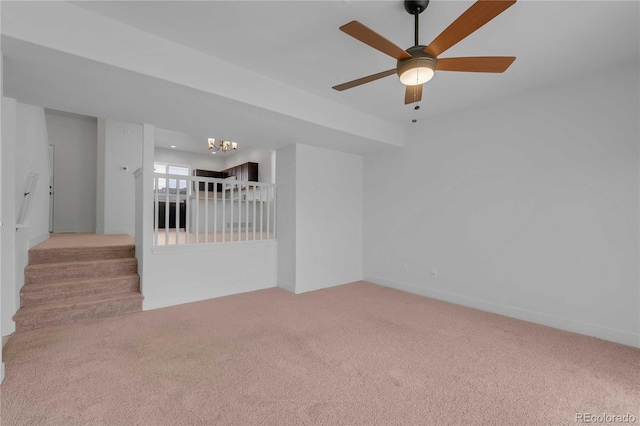 827 Forest Canyon Rd, Severance, CO 80550 - empty room with carpet floors, a chandelier, stairs, and ceiling fan