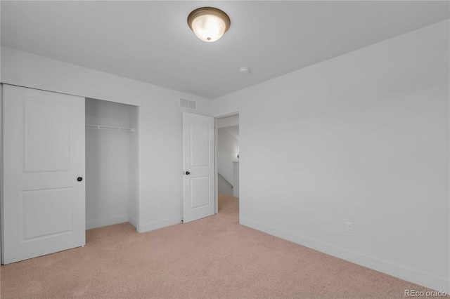 827 Forest Canyon Rd, Severance, CO 80550 - unfurnished bedroom featuring light carpet, baseboards, and a closet
