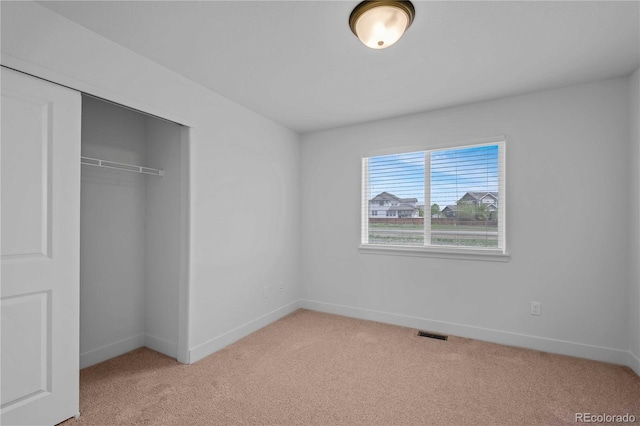 827 Forest Canyon Rd, Severance, CO 80550 - unfurnished bedroom with light carpet, a closet, and baseboards