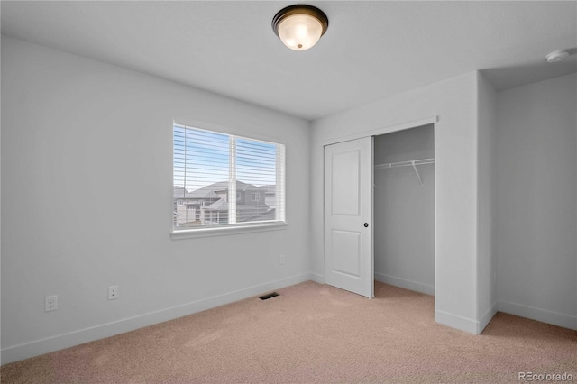 827 Forest Canyon Rd, Severance, CO 80550 - unfurnished bedroom featuring light carpet, baseboards, and a closet