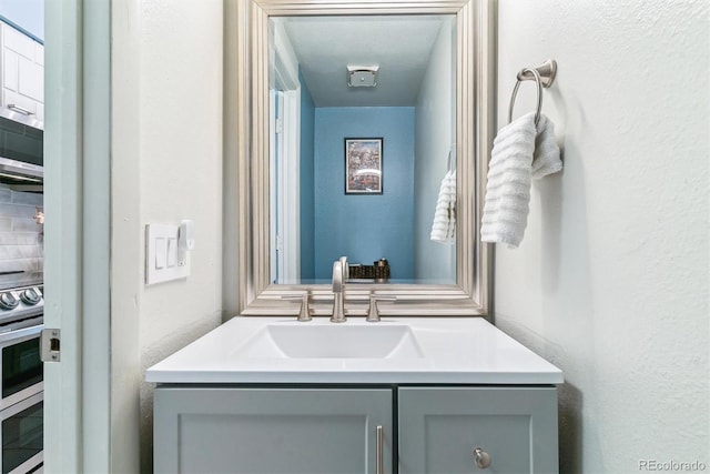 7995 E Mississippi Ave Unit C11, Denver, CO 80247 - bathroom with a textured wall and vanity