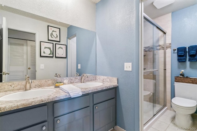7995 E Mississippi Ave Unit C11, Denver, CO 80247 - full bath with toilet, a sink, double vanity, and a shower stall