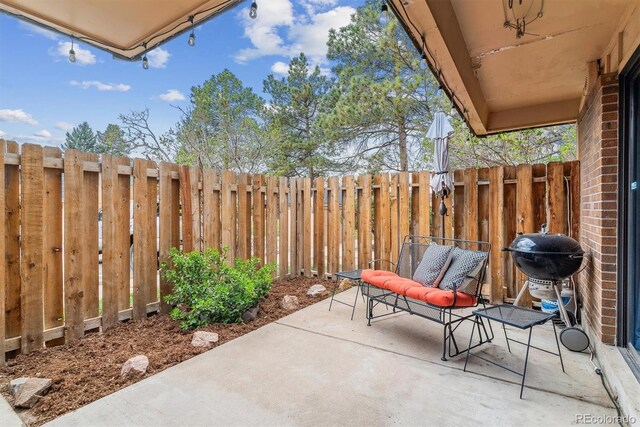 7995 E Mississippi Ave Unit C11, Denver, CO 80247 - view of patio / terrace with a fenced backyard and area for grilling