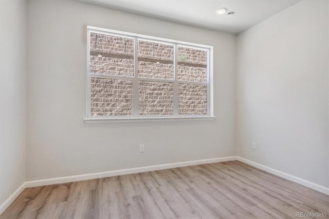457 Interlocken Blvd Unit 101, Broomfield, CO 80021 - unfurnished room with wood finished floors and baseboards