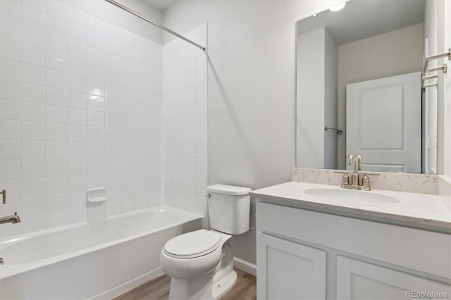457 Interlocken Blvd Unit 101, Broomfield, CO 80021 - full bathroom featuring wood finished floors, toilet, vanity, shower / washtub combination, and baseboards