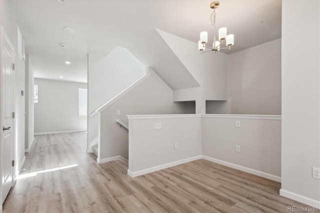 457 Interlocken Blvd Unit 101, Broomfield, CO 80021 - unfurnished dining area with wood finished floors, a chandelier, baseboards, and recessed lighting