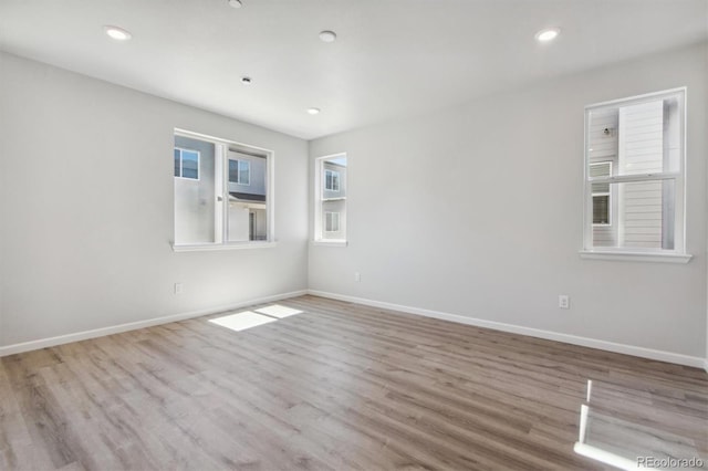 457 Interlocken Blvd Unit 101, Broomfield, CO 80021 - empty room with wood finished floors, baseboards, and recessed lighting