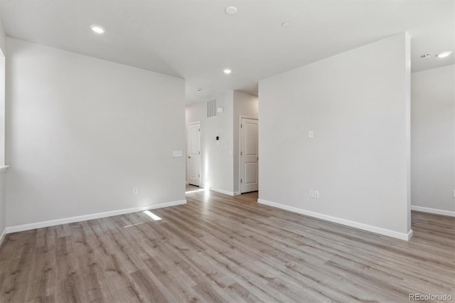 457 Interlocken Blvd Unit 101, Broomfield, CO 80021 - unfurnished room featuring light wood-style flooring, recessed lighting, and baseboards