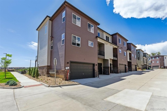 457 Interlocken Blvd Unit 101, Broomfield, CO 80021 - view of building exterior with a residential view and an attached garage