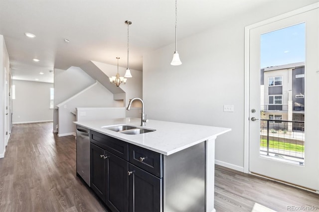 457 Interlocken Blvd Unit 101, Broomfield, CO 80021 - kitchen with wood finished floors, dishwasher, a chandelier, recessed lighting, and decorative light fixtures
