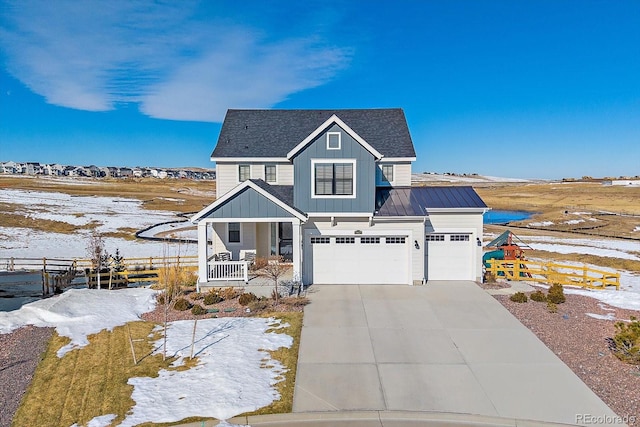 view of front of home with a porch and a garage