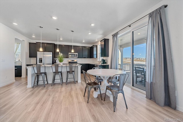 dining room with light wood-type flooring