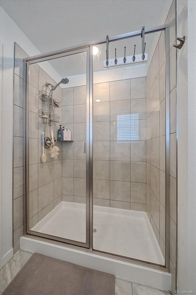 bathroom with an enclosed shower