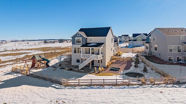 view of snow covered house