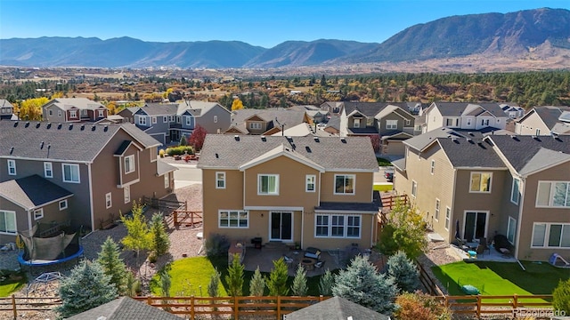 aerial view featuring a mountain view and a residential view