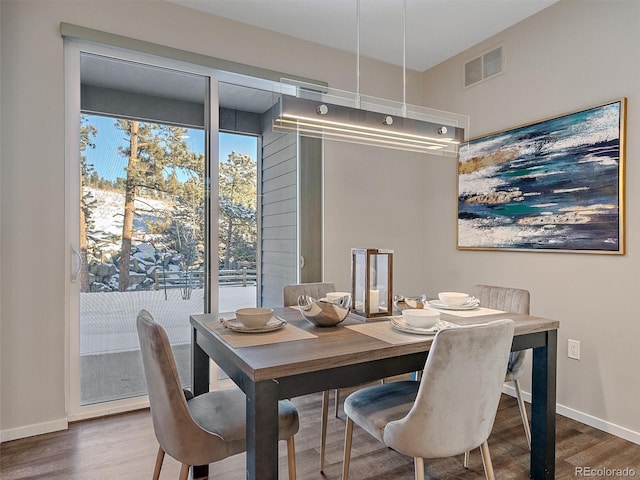 dining area featuring hardwood / wood-style flooring