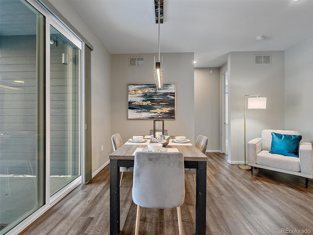 dining area featuring hardwood / wood-style flooring