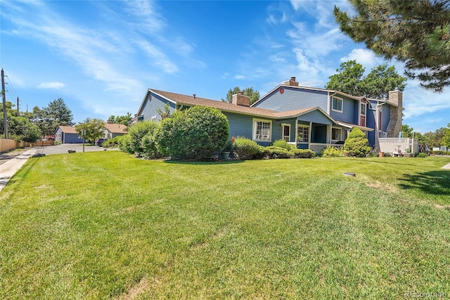 10116 Quivas St, Thornton, CO 80260 - back of house with a chimney and a yard