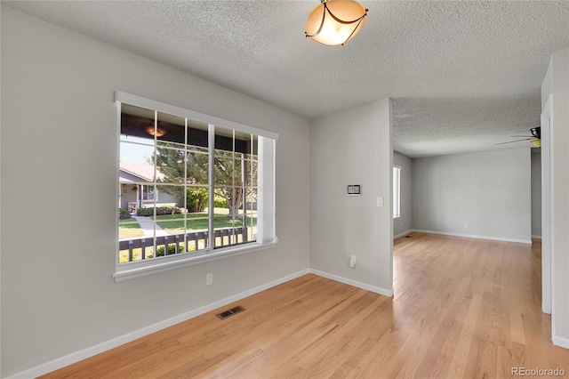 10116 Quivas St, Thornton, CO 80260 - unfurnished room with plenty of natural light, a textured ceiling, light wood-type flooring, and ceiling fan