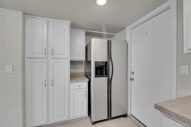 10116 Quivas St, Thornton, CO 80260 - kitchen with stainless steel fridge, white cabinets, and light countertops