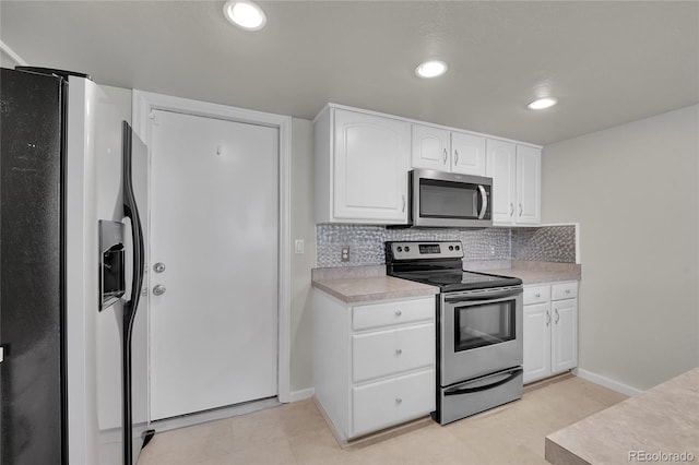 10116 Quivas St, Thornton, CO 80260 - kitchen featuring stainless steel appliances, light countertops, white cabinets, tasteful backsplash, and recessed lighting