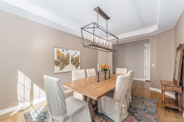 dining space featuring hardwood / wood-style flooring