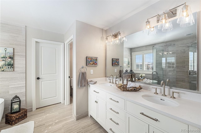 bathroom featuring hardwood / wood-style floors, vanity, tile walls, and walk in shower