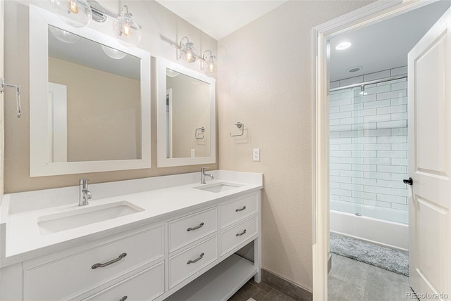 bathroom with vanity and tiled shower / bath combo