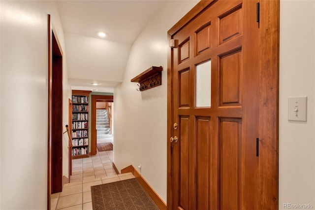 corridor with light tile patterned floors