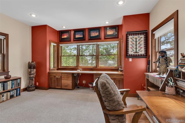 office featuring light colored carpet and built in desk