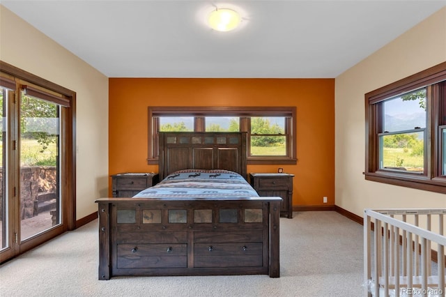 carpeted bedroom featuring access to outside