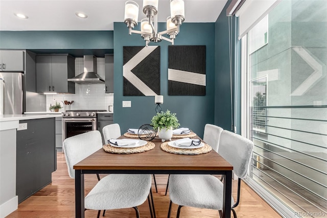 4922 Lowell Blvd Unit 2, Denver, CO 80221 - dining area featuring a chandelier, recessed lighting, and light wood-style flooring