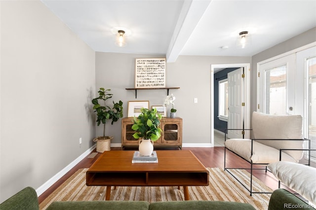 living room with beamed ceiling and hardwood / wood-style flooring