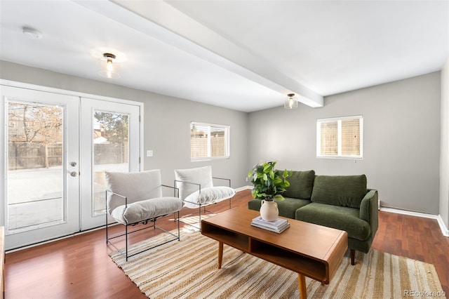 living room with french doors, wood-type flooring, and beam ceiling