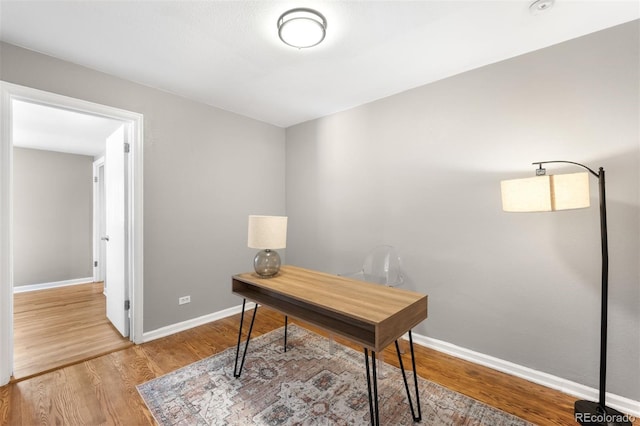 office space with light hardwood / wood-style flooring