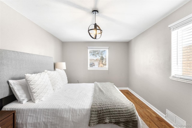 bedroom with wood-type flooring