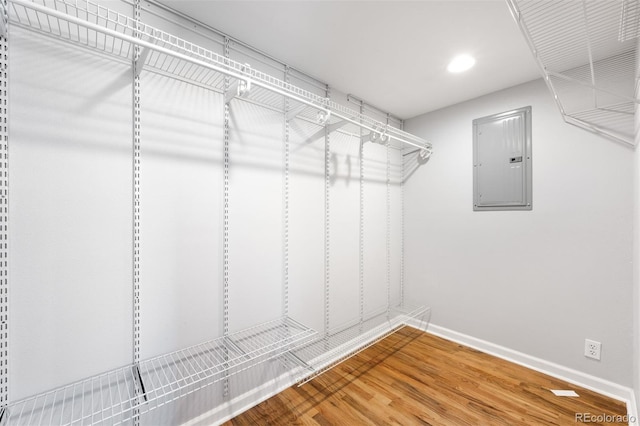 spacious closet with wood-type flooring and electric panel