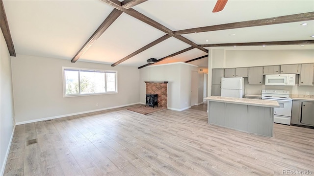 720 Northwoods Dr W, Woodland Park, CO 80863 - kitchen featuring white appliances, open floor plan, gray cabinetry, and lofted ceiling with beams