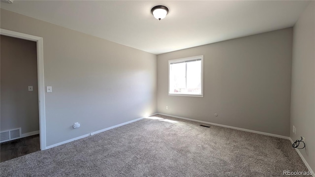 720 Northwoods Dr W, Woodland Park, CO 80863 - carpeted empty room with baseboards and visible vents